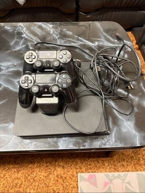 Sony Black PS4 Slim with Two DualShock Controllers and Charging Dock